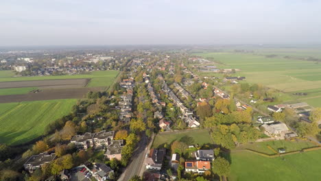 Drone-over-rural-town,-revealing-church