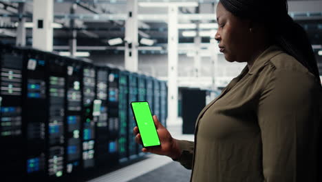 software developer using app on mockup phone to do server hub checkup