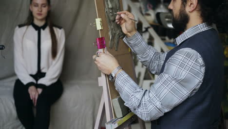 sculpting a portrait in a studio