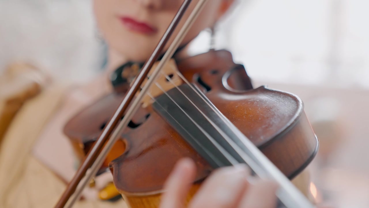 Elegant Woman Playing Classical Music on a Violin