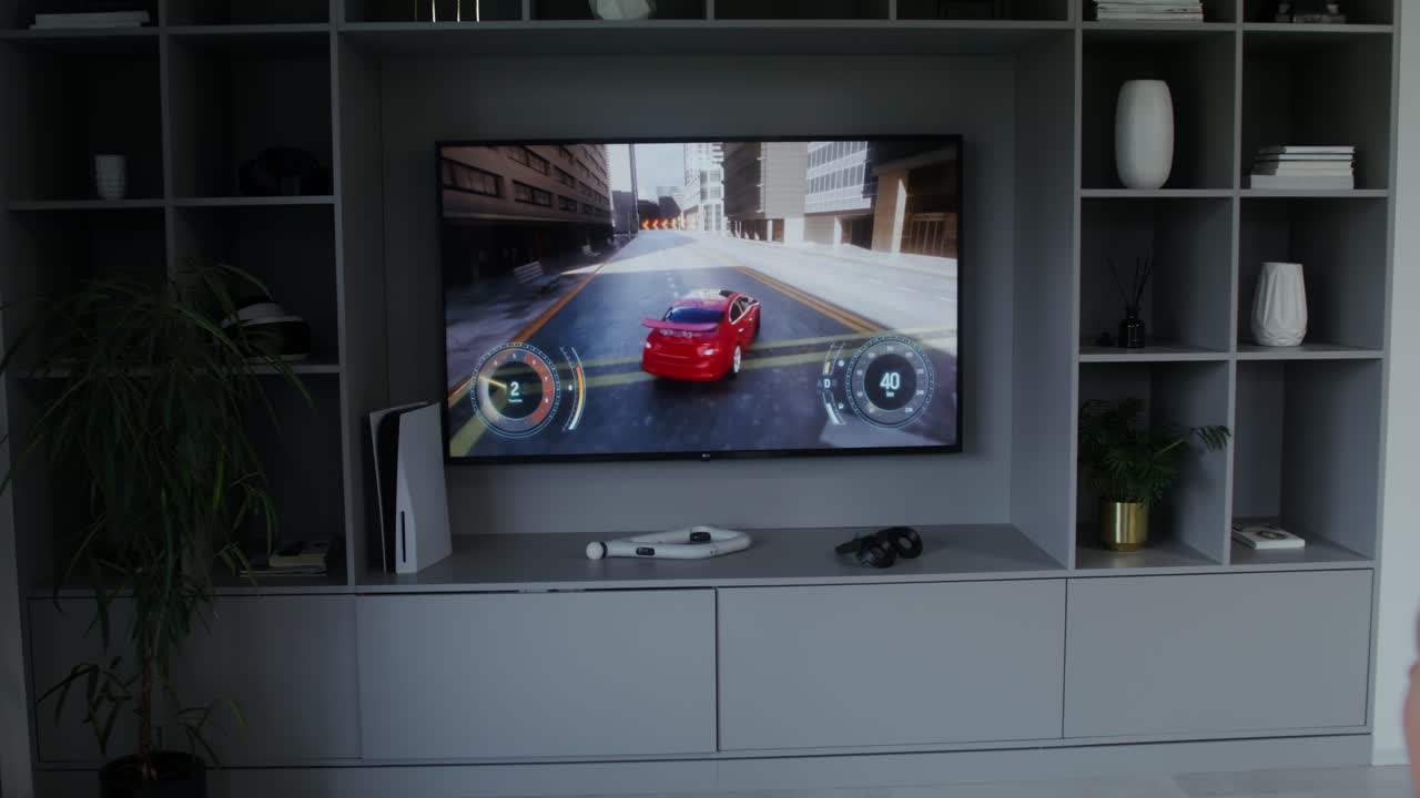 A man plays a car game on PlayStation