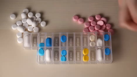 organizing pills in a pill organizer