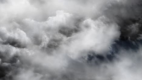 view entering thick white cumulonimbus clouds with lightning strikes