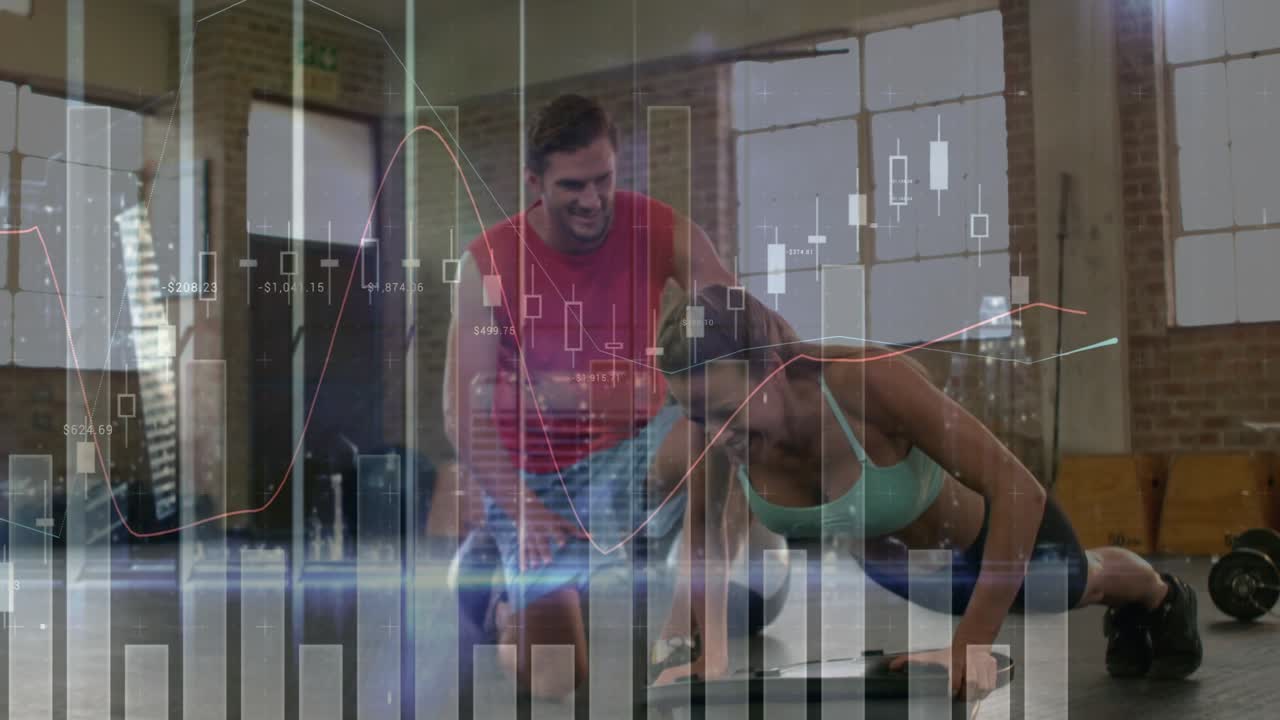 Male trainer kneeling and cueing, female trainee alternating plank rows with dumbbells for fitness