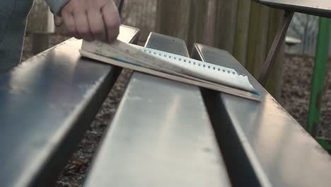 reading a map on park bench