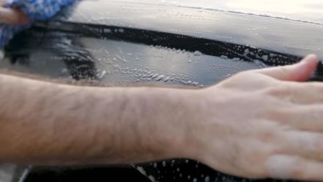 clay barring a black car wing fender