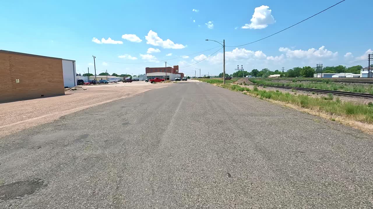 POV - Driving on a Hickory Street along the train tracks on the edge of small Midwestern town;hometown