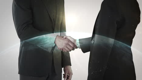 Two-business-people-shaking-hand-in-front-of-globe