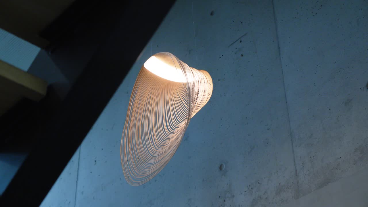 Beautiful geometric circle shade hanging on a chandeleir in a house