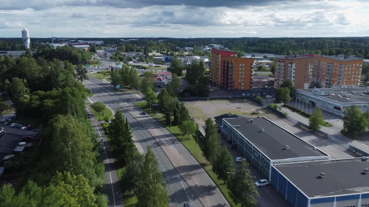 Low flyover of picturesque streets of Kerava in vast Finland forest