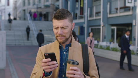 portrait-of-charming-caucasian-man-in-city-drinking-coffee-beverage-enjoying-urban-lifestyle