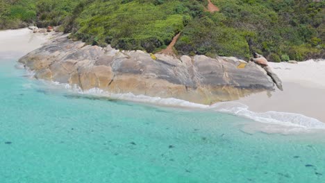 Cinematic-drone-flight-around-rock-in-Southern-Western-Australia-in-summer