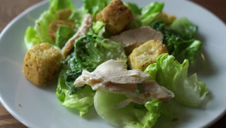 caesar salad with chicken on plate