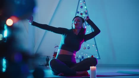 woman relaxing with christmas lights
