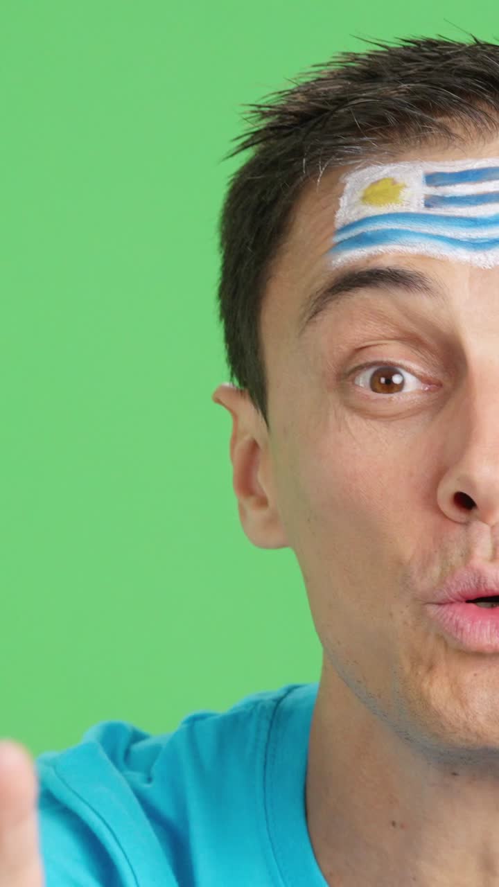 Close up of a man supporting uruguayan team