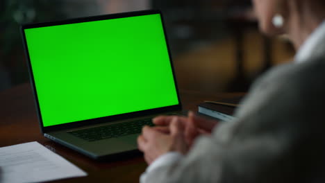 Unrecognizable-elderly-woman-having-web-conference-at-mockup-computer-at-home