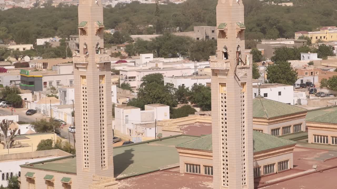 Nouakchott, Mauritania close up view of the Mosque Ould Abas, Nouakchott twin towers with cityscape on background