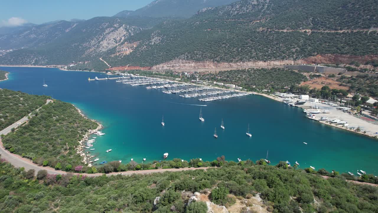 Drone shot of Kaş marina in Antalya region of T&uuml;rkiye with blue waters