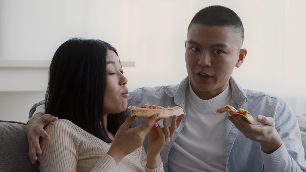 Couple Eating Pizza
