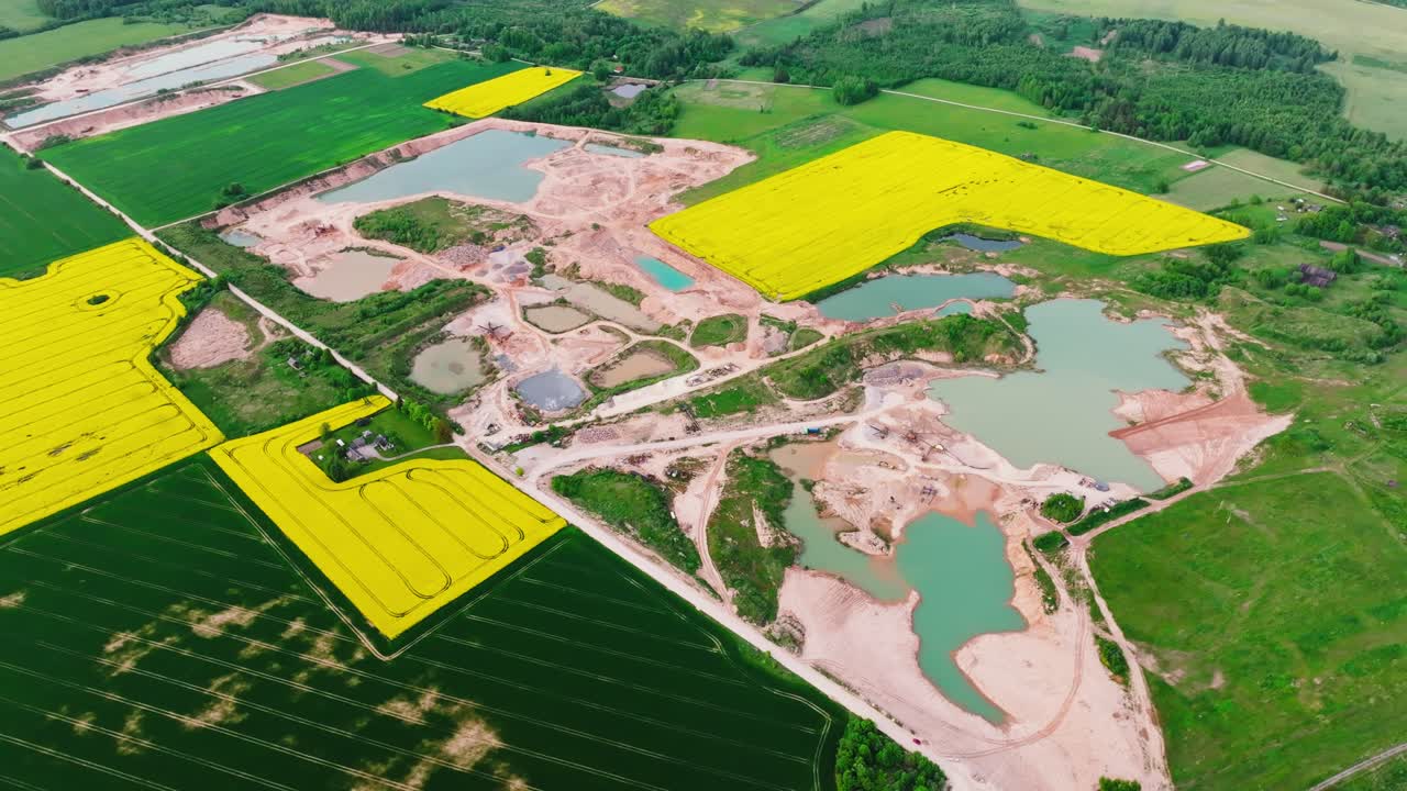 Drone sideways over Slampes gravel quarry in Tukums region, spring landscape mix