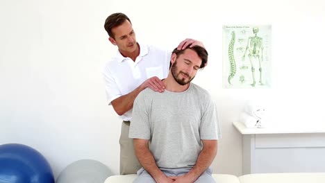 physiotherapist rubbing patients injured neck