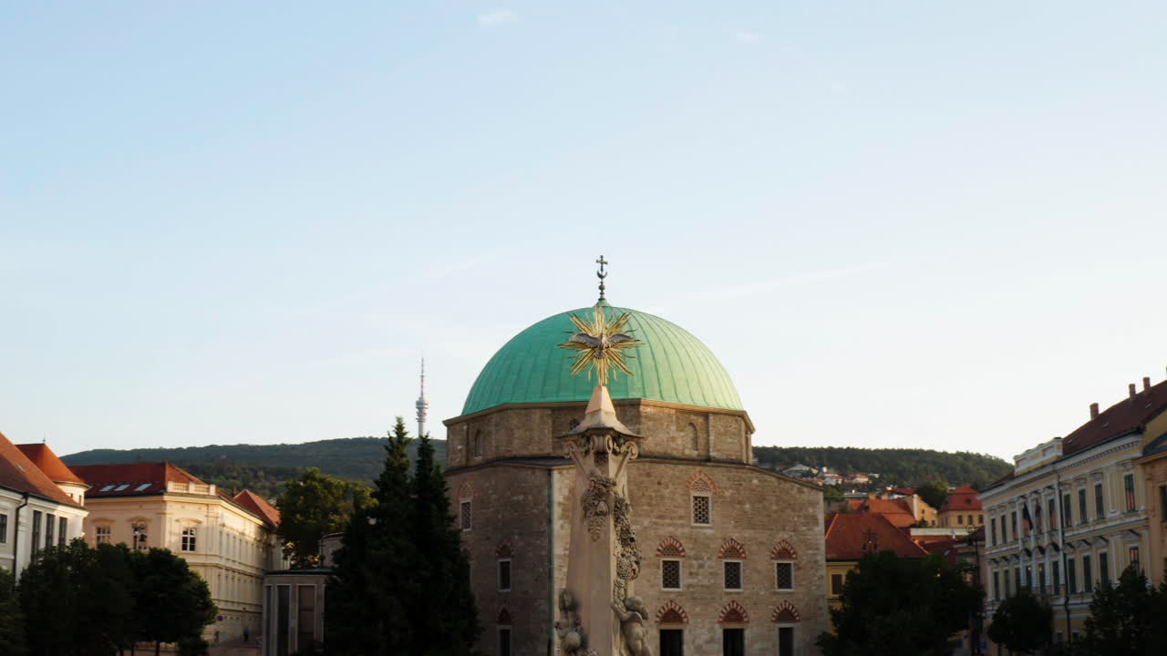 View Of Mosque of Pasha Qasim At Sunrise In Pecs, Hungary - drone shot