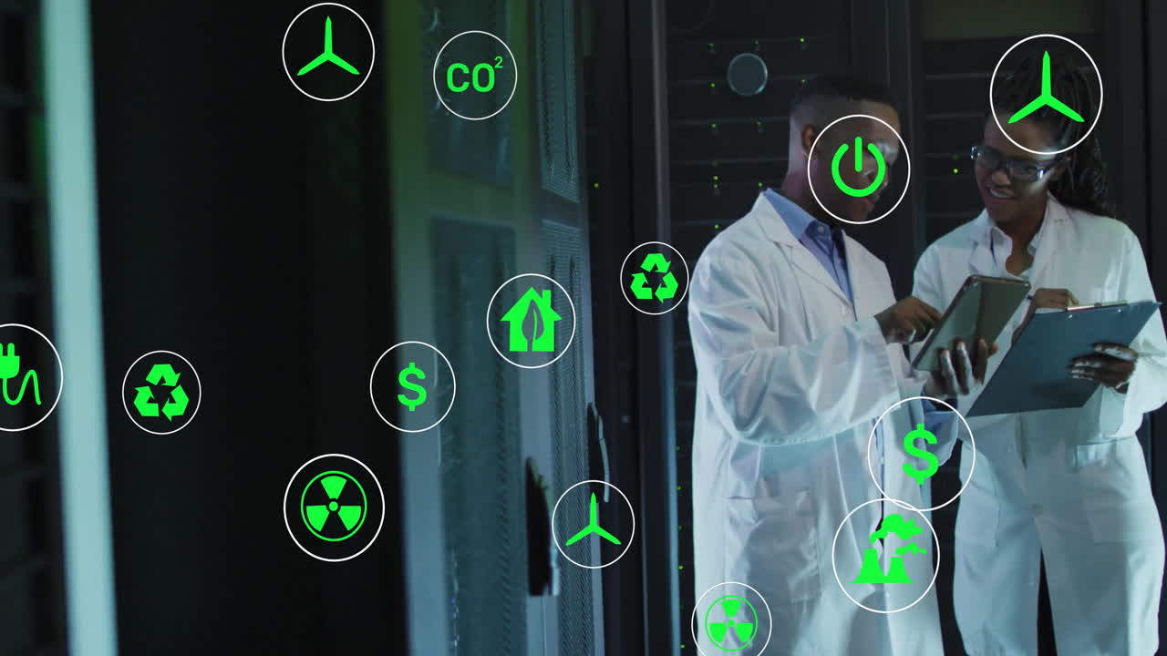 In lab, scientists working with animation of technology icons overlaying scene