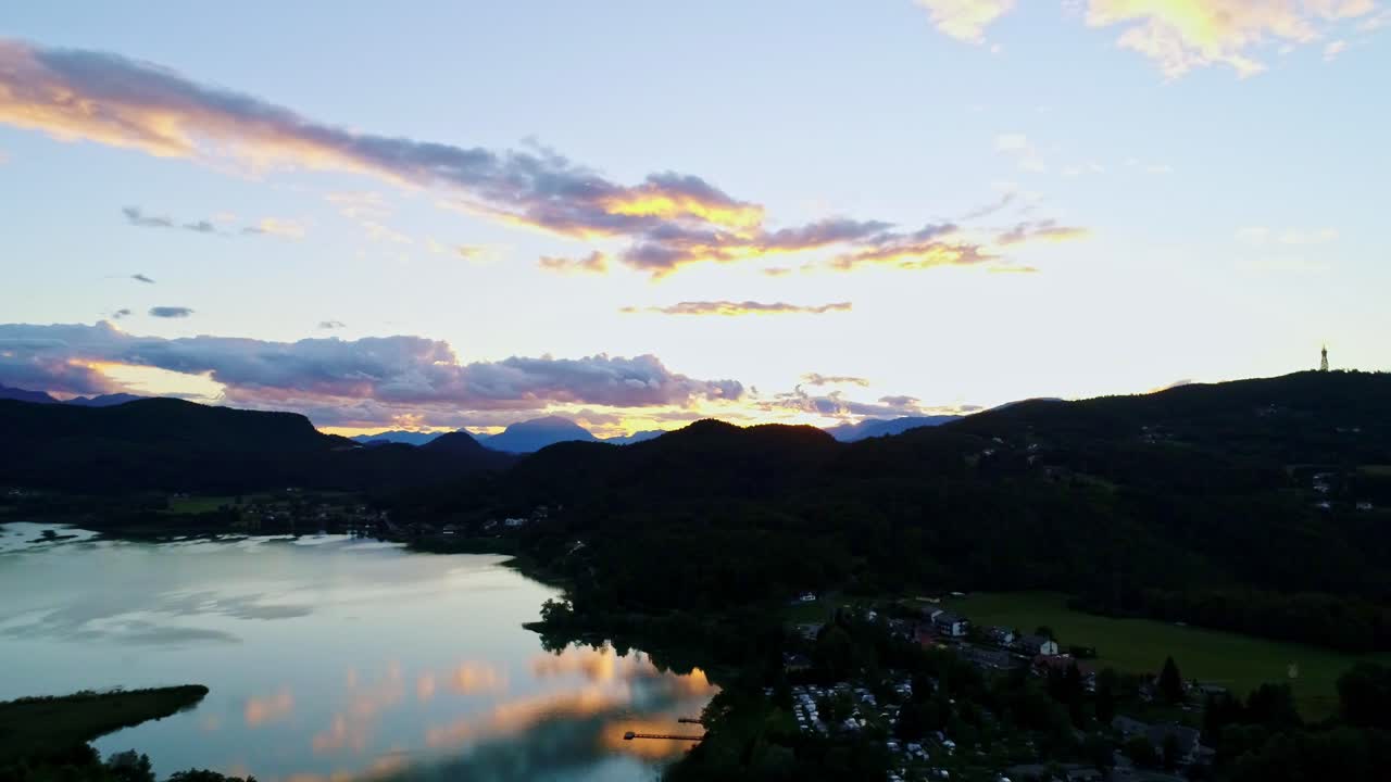 Panoramic aerial rotation captures Austria’s stunning sunset-lit landscape, 4K
