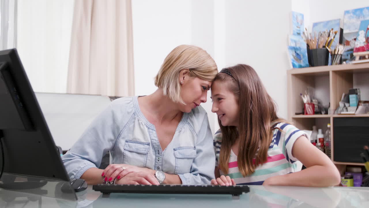 Mother and daughter at the desk