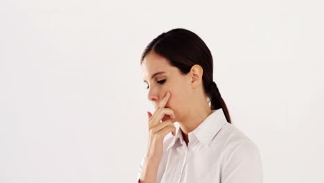 Businesswoman-standing-against-white-background