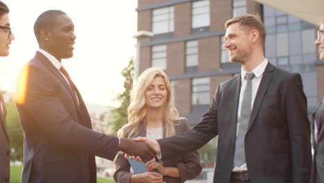 business people talking and shaking hands