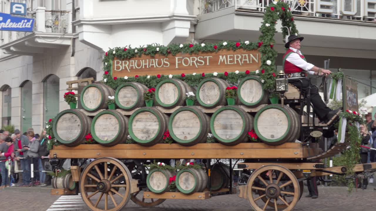 Horse-drawn carriage of the Forst brewery during the grape festival parade in Meran - Merano, South Tyrol, Italy (part 2 of 2)