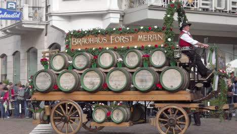 horse-drawn carriage of the forst brewery during the grape festival parade in meran - merano, south tyrol, italy (part 2 of 2)