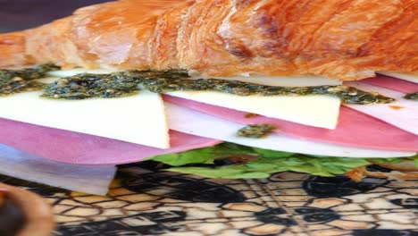 croissant sandwich with pesto and ham