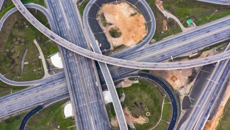 timelapse aerial view of a freeway intersection traffic trails in moscow.