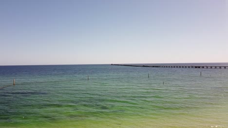 pan right clip of busselton jetty with train travelling back to the shore