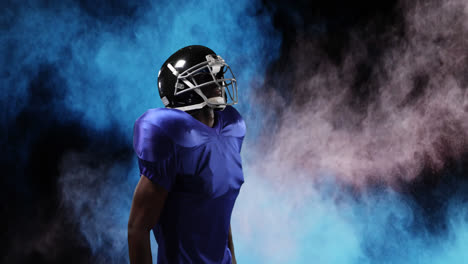 Male-rugby-player-against-smoke-explosions-in-background