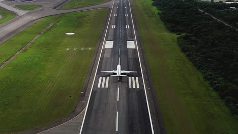 aerial view following a plane on a runaway