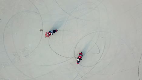 Motorbike riding on road. Aerial view of driving on empty parking on motorcycle