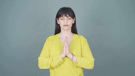 Woman-meditating-looking-at-camera.