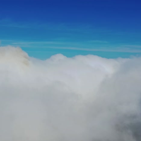 scenic view of beautiful sky. flying among soft white clouds moving on blue sky. high in blue sky through the fluffy clouds.