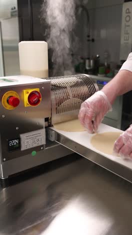 automated dough rolling machine in action