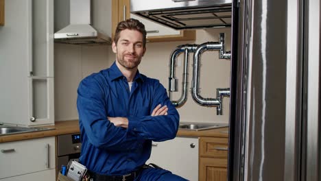 plumber repairing kitchen appliances