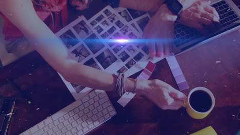 In school, people collaborating on animation using color swatches and photographs