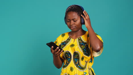 Cheerful-pleased-woman-dancing-around-on-playlist-music