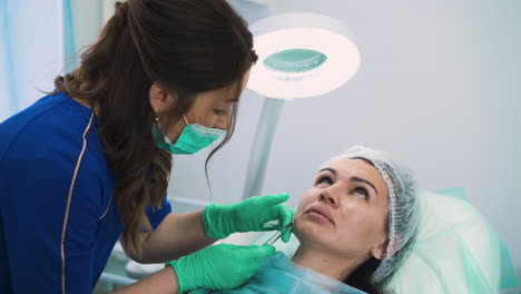 middle-aged-lady-undergoes-procedure-of-filler-injection