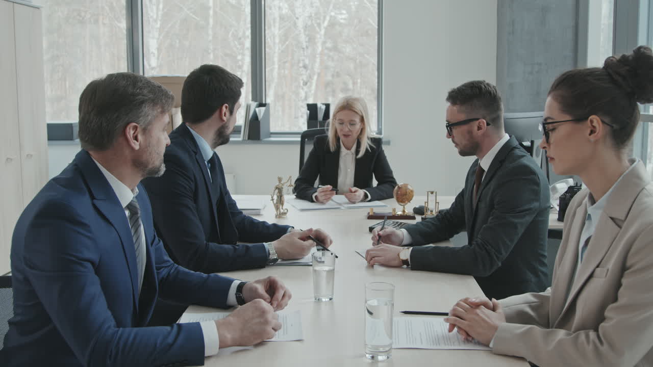 Lawyers Discussing Case at Meeting Table