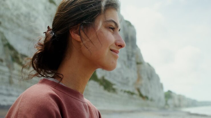 Woman on a Coastal Cliff