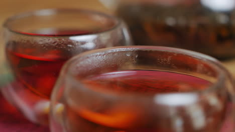 close-up of glass tea cups and teapot