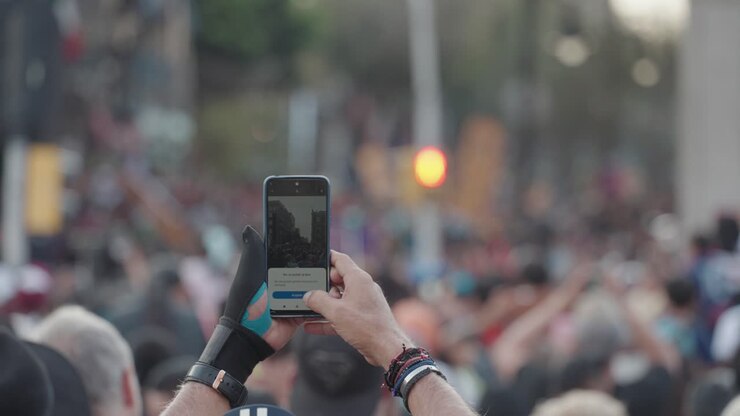 Person Taking Picture of Crowd with Phone